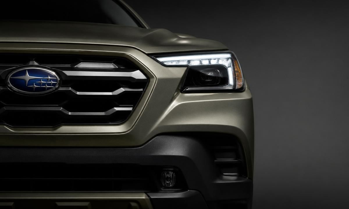 Close-up of the 2026 Outback's front grille and LED headlight